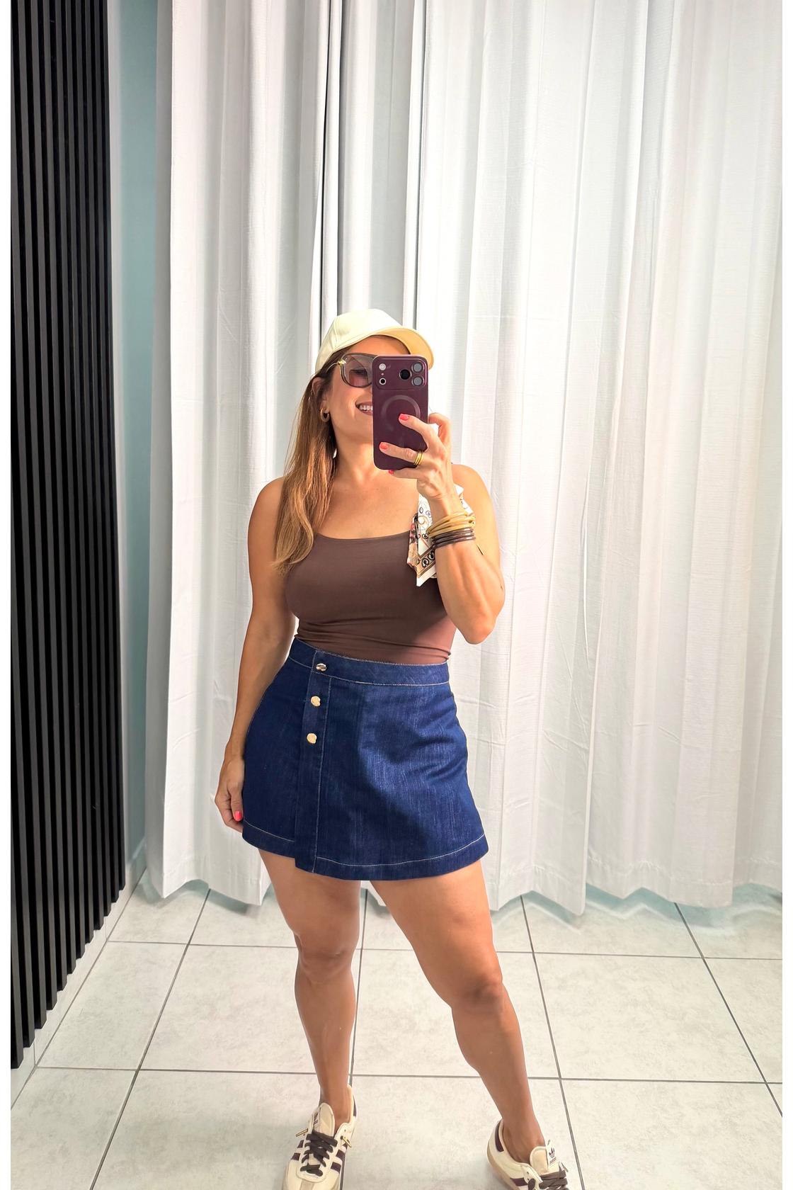 Fashion Denim skort with front closure and button.