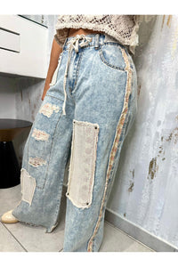 Designed in floral patchwork relaxed fit pants in
denim with embroidery detail