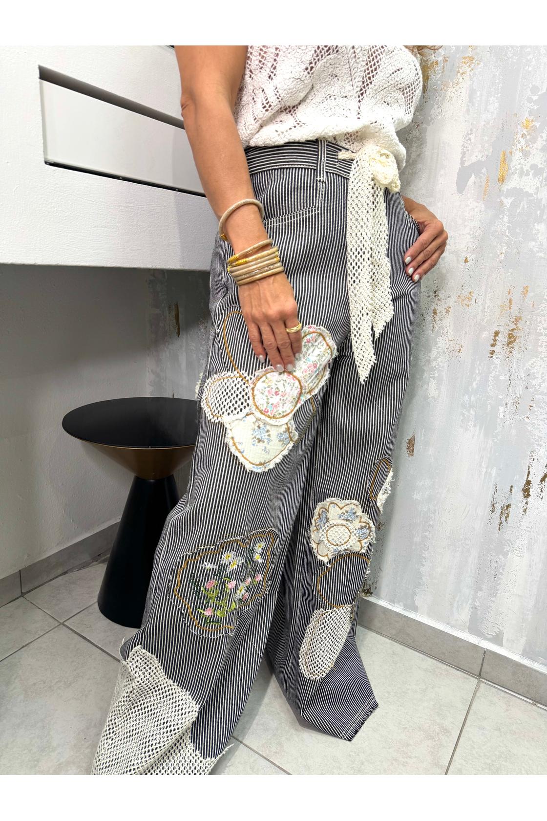 Designed in wide fit bottom in twill with varied floral
and, floral embroidered 
accented pockets, and buckle back detail, crochet.