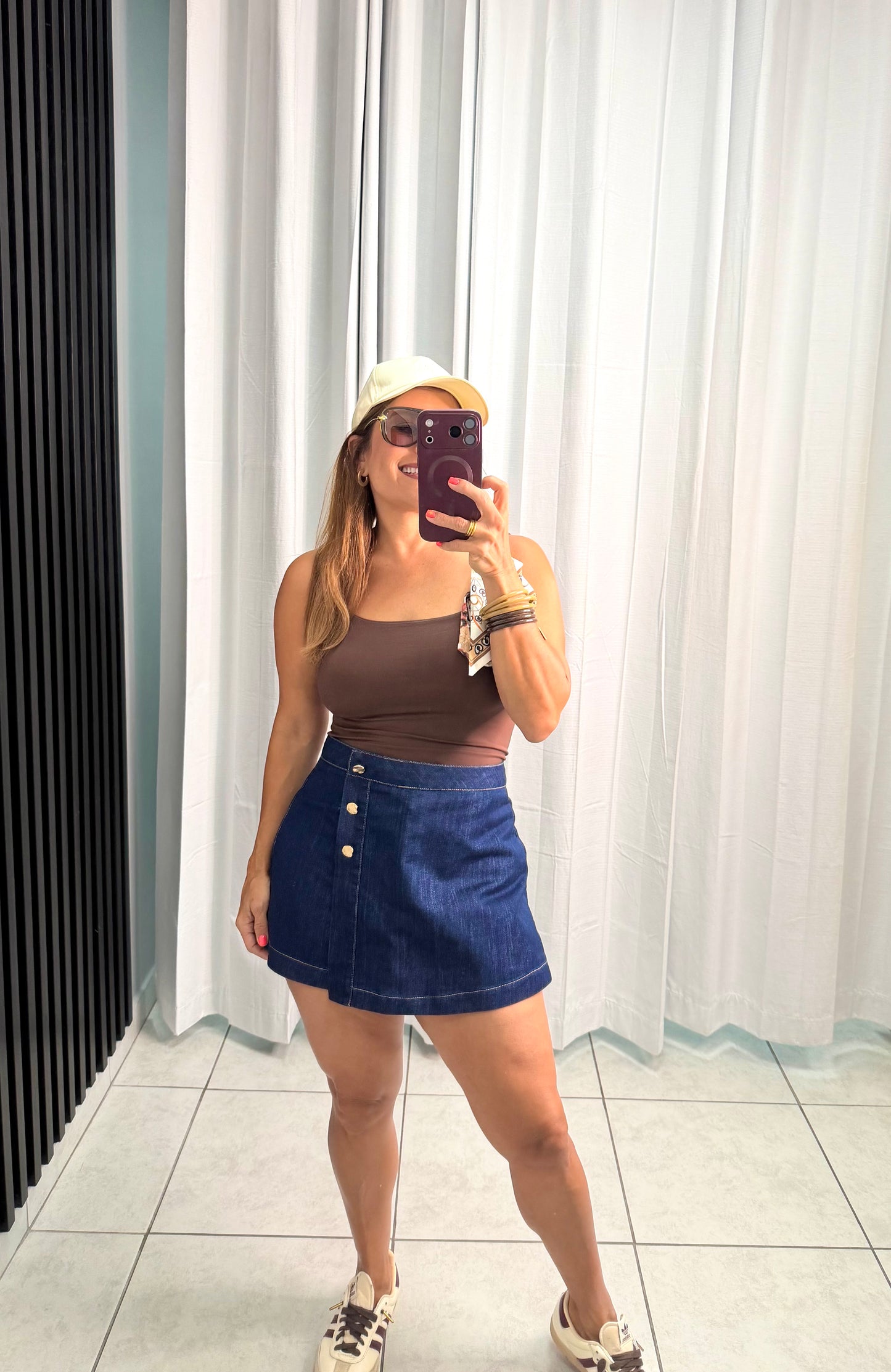 Fashion Denim skort with front closure and button.