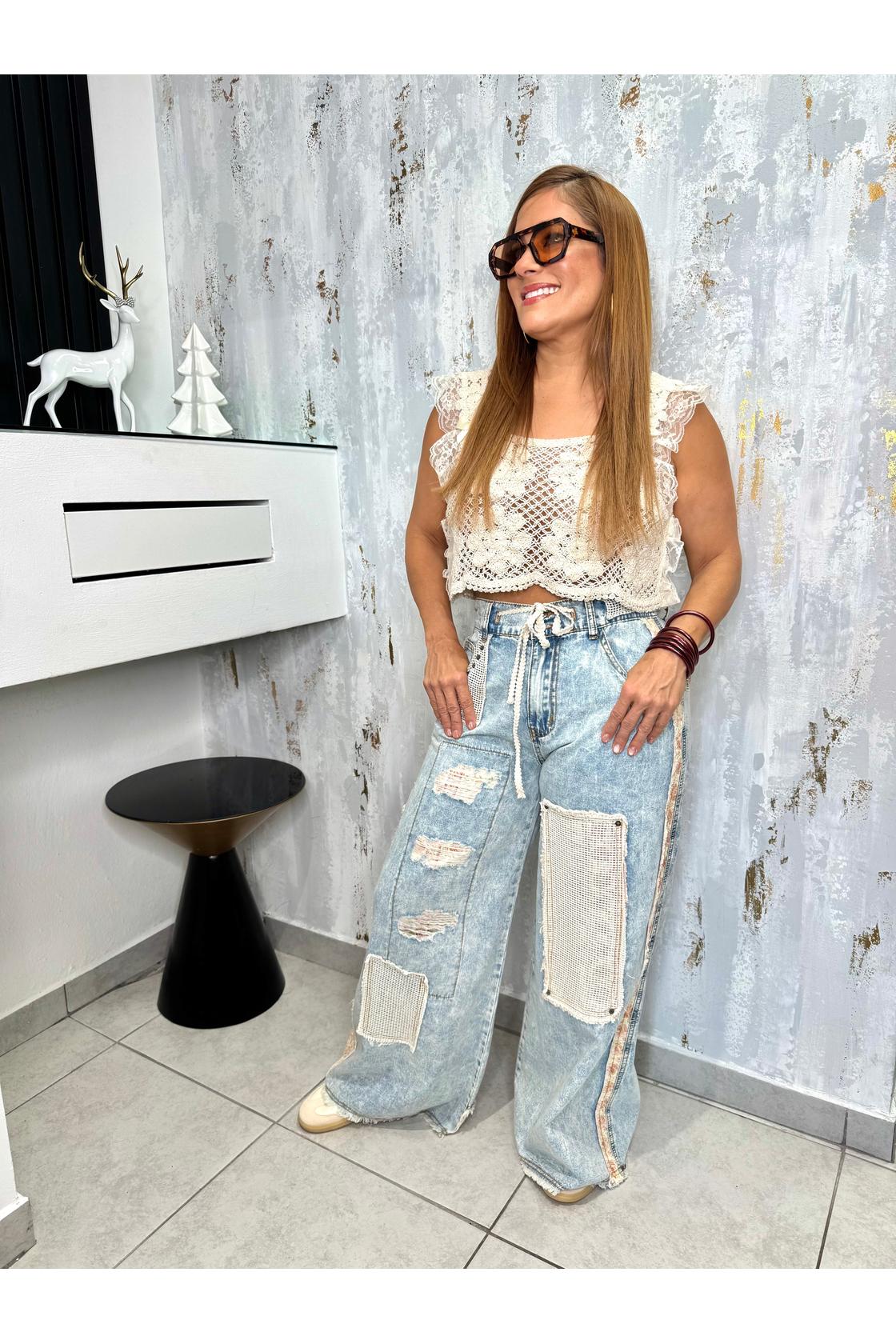 Designed in floral patchwork relaxed fit pants in
denim with embroidery detail